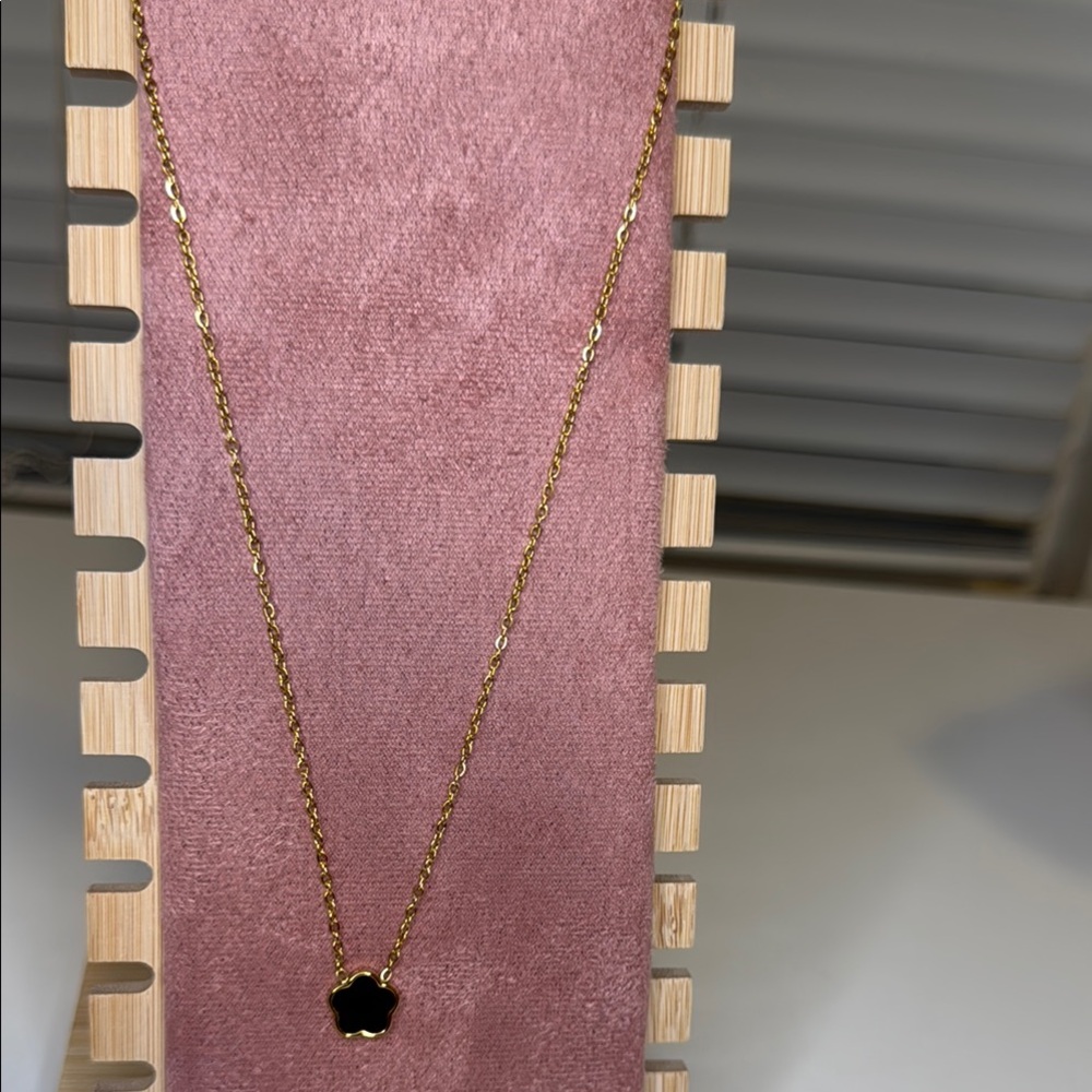 Elegant Gold Necklace with Black Pendant